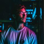 man-wearing-eye-glasses-under-neon-lights.jpg